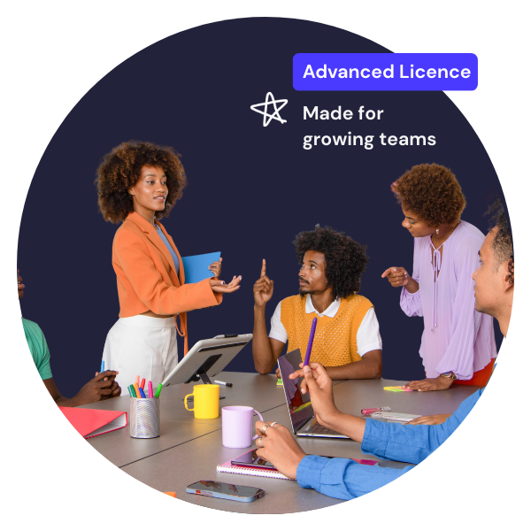 team of people sat at a meeting room desk with colourful post it notes and advanced licence tag